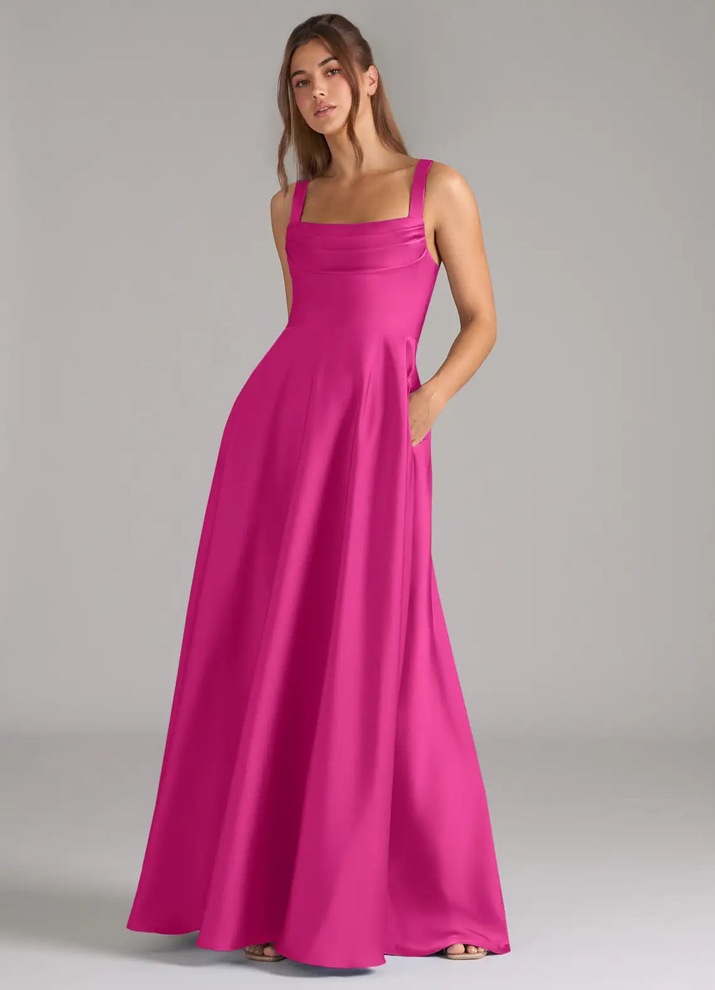 Classic fuchsia satin bridesmaid dress with square neck, wide straps, open back, side pockets and A-line skirt