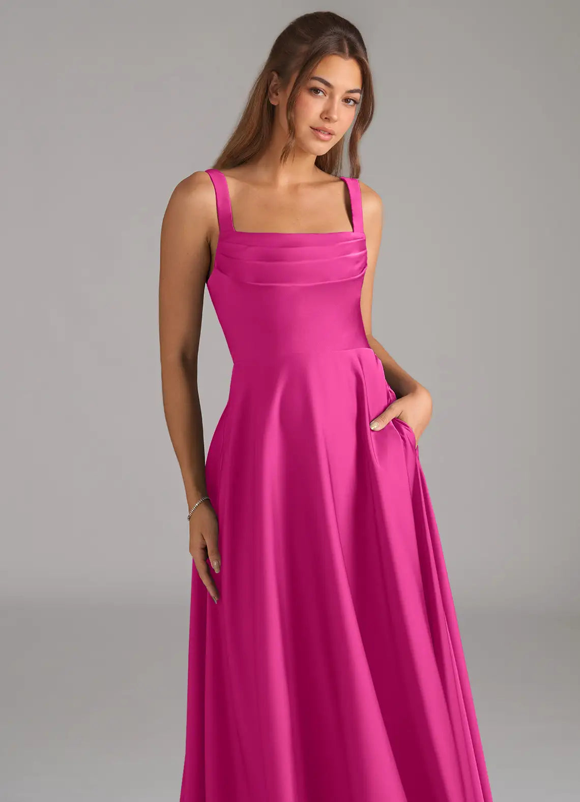 Classic fuchsia satin bridesmaid dress with square neck, wide straps, open back, side pockets and A-line skirt