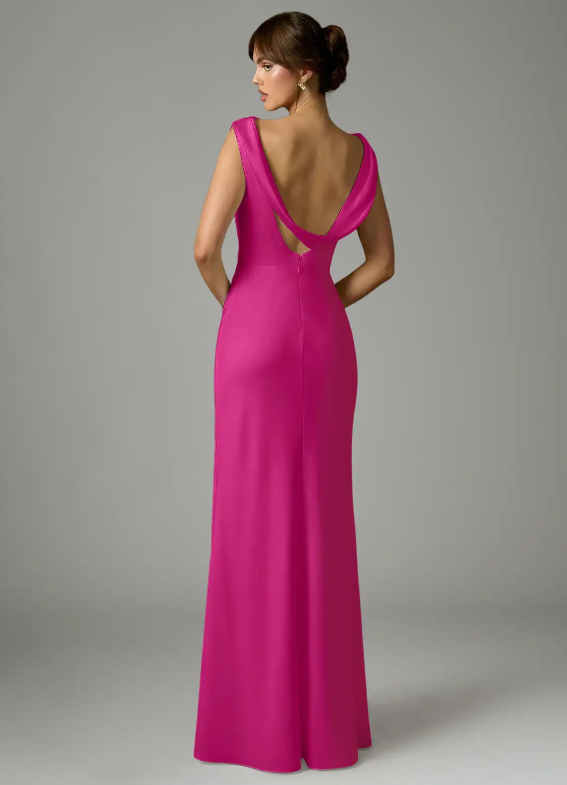 Elegant fuchsia satin bridesmaid dress with cowl neck, draped open back, ruched waist and sheath skirt