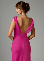 Elegant fuchsia satin bridesmaid dress with cowl neck, draped open back, ruched waist and sheath skirt