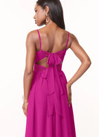 Romantic fuchsia chiffon bridesmaid dress with spaghetti straps, ruched bodice, open back bow, high slit and side pockets