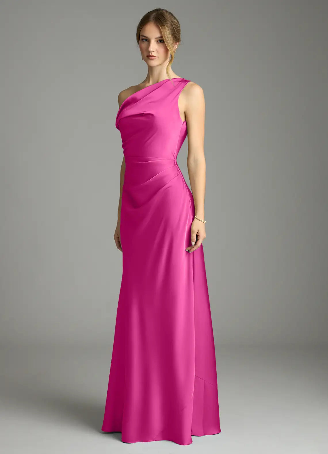 Sleek fuchsia satin bridesmaid dress with convertible one-shoulder, ruched waist and sheath skirt