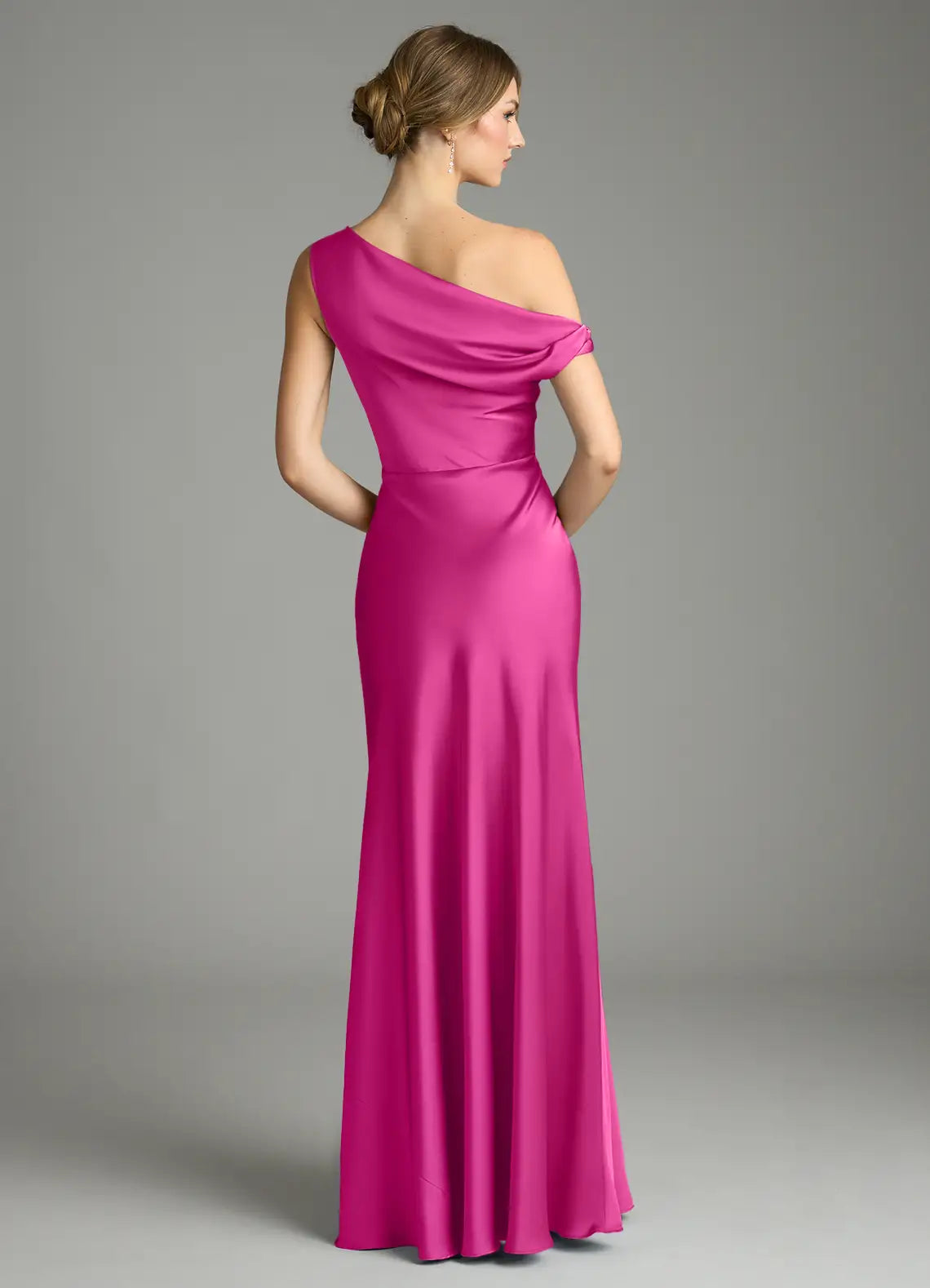Sleek fuchsia satin bridesmaid dress with convertible one-shoulder, ruched waist and sheath skirt