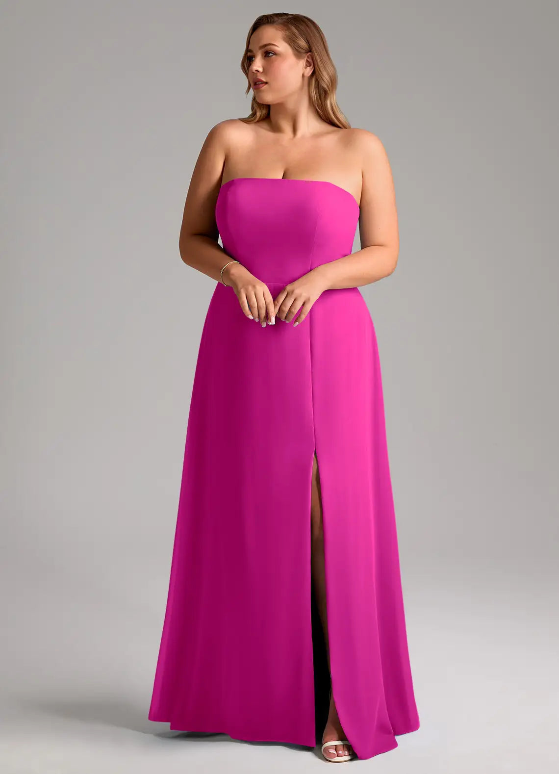 Sleek fuchsia strapless bridesmaid dress with open back, high slit and A-line skirt