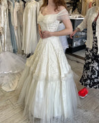 Vintage A-Line Off-Shoulder Lace Floor-Length Wedding Dress With Pearl Accents For Romantic Brides
