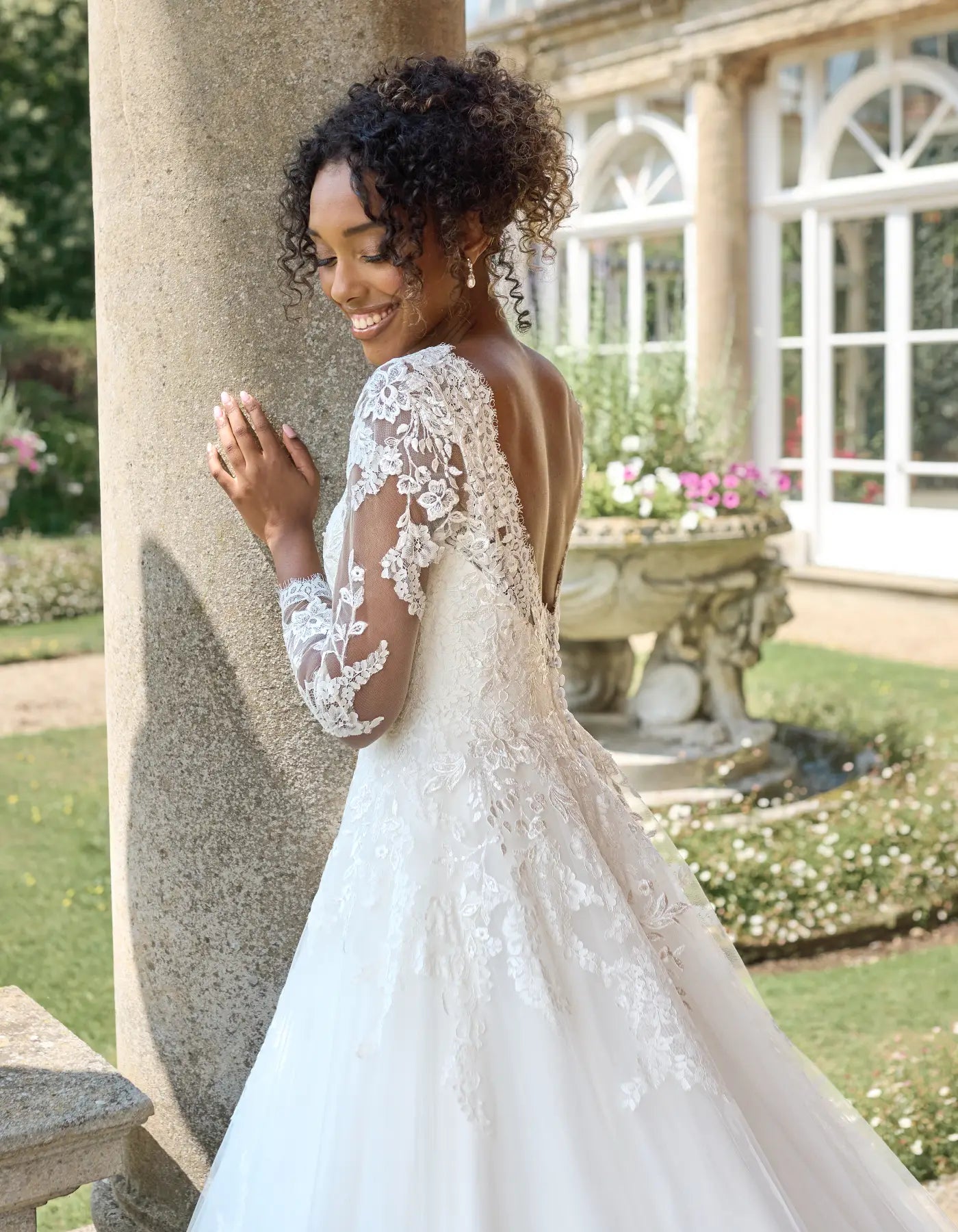 a traditional lace gown with sleeves