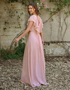 a modern draped bodice with lightweight angel sleeves