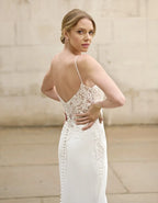 a sleek sheath gown with cut-out train
